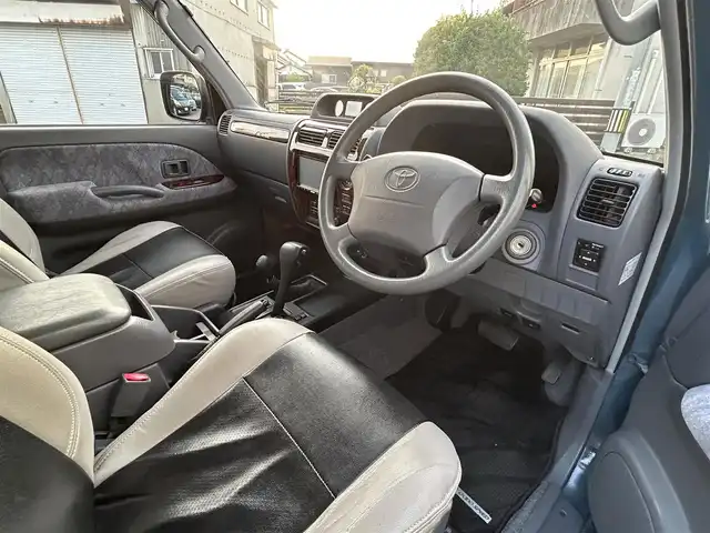 トヨタ ランドクルーザー プラド TX－LTD 愛知県 2000(平12)年 10.8万km 青 4WD/バックカメラ/サンルーフ/背面タイヤ/ルーフレール/社外SDナビ/Bluetooth/DVD/CD/フルセグTV/社外ETC/格納三列シート/社外フロアマット/社外アルミホイール/オフロードタイヤ/パワーステアリング/パワーウインドウ/ABS/取扱説明書/リモコンキー