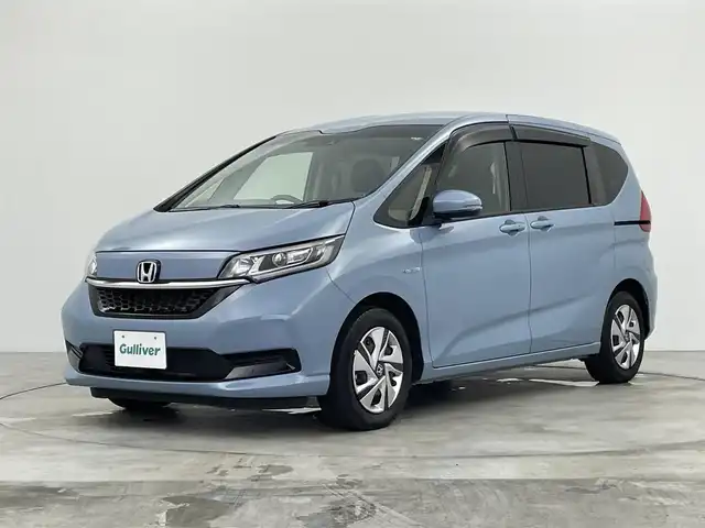 ホンダ フリード ハイブリット G ホンダセンシング 群馬県 2021(令3)年 4.6万km シーグラスブルーパール 純正９インチナビ　バックカメラ　両側パワースライドドア　レーダークルーズコントロール　ＬＥＤ　シートヒーター　ステアリングリモコン　コーナーセンサー　スマートキー　横滑り防止装置　ＥＴＣ　禁煙車