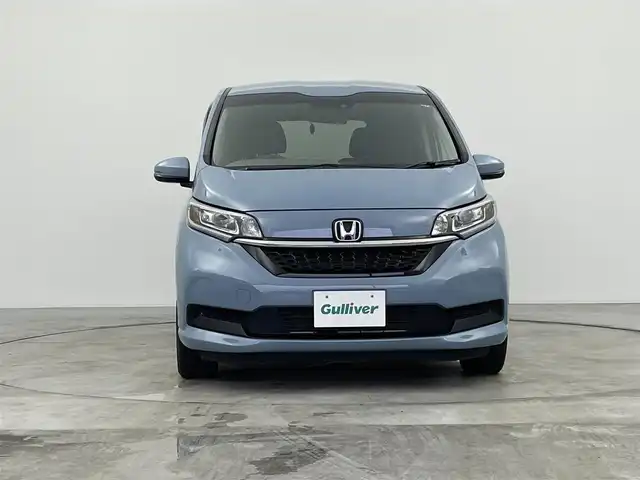 ホンダ フリード ハイブリット G ホンダセンシング 群馬県 2021(令3)年 4.6万km シーグラスブルーパール 純正９インチナビ　バックカメラ　両側パワースライドドア　レーダークルーズコントロール　ＬＥＤ　シートヒーター　ステアリングリモコン　コーナーセンサー　スマートキー　横滑り防止装置　ＥＴＣ　禁煙車
