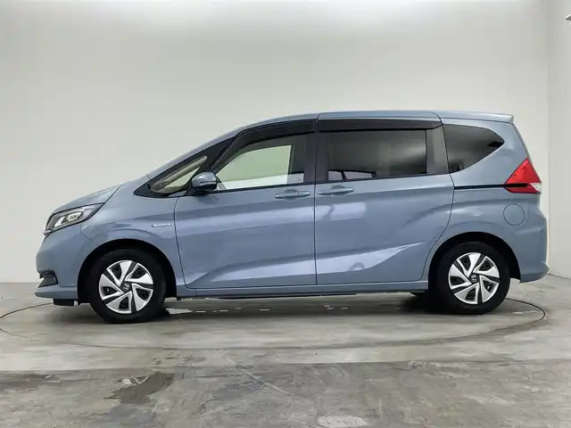 ホンダ フリード ハイブリット G ホンダセンシング 群馬県 2021(令3)年 4.6万km シーグラスブルーパール 純正９インチナビ　バックカメラ　両側パワースライドドア　レーダークルーズコントロール　ＬＥＤ　シートヒーター　ステアリングリモコン　コーナーセンサー　スマートキー　横滑り防止装置　ＥＴＣ　禁煙車