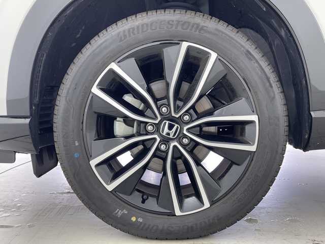 ホンダ ヴェゼル ハイブリッド e:HEV Z 愛知県 2024(令6)年 2.4万km プレミアムサンライトホワイトパール 純正ナビ/・フルセグ/・Bluetooth/マルチビューカメラシステム/ビルドインETC2.0/前後ドライブレコーダー/前席シートヒーター/ステアリングヒーター/ABS/レーンキープアシスト/車線逸脱抑制装置/コーナーセンサー/衝突軽減ブレーキ/横滑り防止装置/先行車発信告知機能/標識認識機能/盗難防止装置/ワイヤレス充電器/オートライト/純正18インチアルミホイール/オートライト/LEDヘッドライト/パワーステアリング/パワーウィンドウ/純正アルミホイール/純正フロアマット