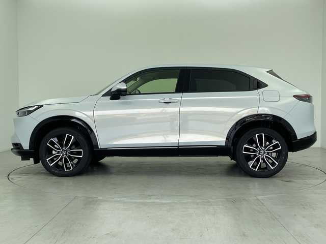 ホンダ ヴェゼル ハイブリッド e:HEV Z 愛知県 2024(令6)年 2.4万km プレミアムサンライトホワイトパール 純正ナビ/・フルセグ/・Bluetooth/マルチビューカメラシステム/ビルドインETC2.0/前後ドライブレコーダー/前席シートヒーター/ステアリングヒーター/ABS/レーンキープアシスト/車線逸脱抑制装置/コーナーセンサー/衝突軽減ブレーキ/横滑り防止装置/先行車発信告知機能/標識認識機能/盗難防止装置/ワイヤレス充電器/オートライト/純正18インチアルミホイール/オートライト/LEDヘッドライト/パワーステアリング/パワーウィンドウ/純正アルミホイール/純正フロアマット