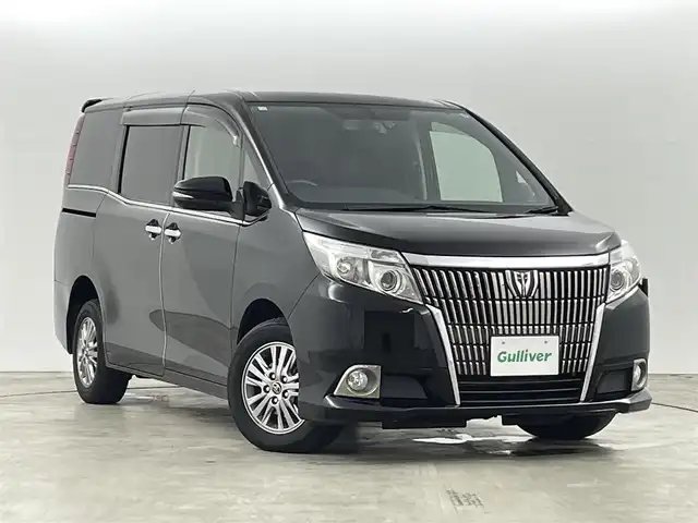 トヨタ エスクァイア 福島県 2014(平26)年 7.1万km ブラック トヨタセーフティセンス/・衝突被害軽減ブレーキ/・車線逸脱警報装置/・レーダークルーズコントロール/・アダプティブハイビーム/純正9インチナビ/・型番：NSZT-Y64T/・フルセグTV/BT/SD/CD/DVD/FM/AM/・バックカメラ/・ETC/両側パワースライドドア/・スライドドアロールサンシェード/革張ステアリング/・ステアリングリモコン/MTモード付AT/レザーシート/・D+N席シートヒーター/アイドリングストップ/プッシュスタート/・スマートキー/電動格納ミラー/・ウィンカーミラー/・オートミラー/LEDヘッドライト/・フォグランプ/・オートライト/・オートハイビーム/寒冷地仕様/純正フロアマット/純正15インチAW