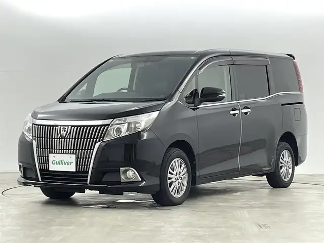 トヨタ エスクァイア 福島県 2014(平26)年 7.1万km ブラック トヨタセーフティセンス/・衝突被害軽減ブレーキ/・車線逸脱警報装置/・レーダークルーズコントロール/・アダプティブハイビーム/純正9インチナビ/・型番：NSZT-Y64T/・フルセグTV/BT/SD/CD/DVD/FM/AM/・バックカメラ/・ETC/両側パワースライドドア/・スライドドアロールサンシェード/革張ステアリング/・ステアリングリモコン/MTモード付AT/レザーシート/・D+N席シートヒーター/アイドリングストップ/プッシュスタート/・スマートキー/電動格納ミラー/・ウィンカーミラー/・オートミラー/LEDヘッドライト/・フォグランプ/・オートライト/・オートハイビーム/寒冷地仕様/純正フロアマット/純正15インチAW