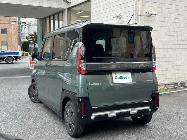 三菱 デリカミニ G 東京都 2024(令6)年 0.1万km 緑 登録時走行215km/e-アシスト（運転支援機能）/・衝突被害軽減ブレーキシステム/・前方衝突予測警報/・踏み間違い衝突防止アシスト/・標識検知システム/・車線逸脱警報システム/・車線逸脱防止支援機能/・先行車発進通知/・オートマチックハイビーム/・ふらつき警報/社外ディスプレイオーディオ/バックカメラ/ハンズフリーパワースライドドア/LEDライト/スマートキー/オートエアコン/保証書・取説/スペアキー