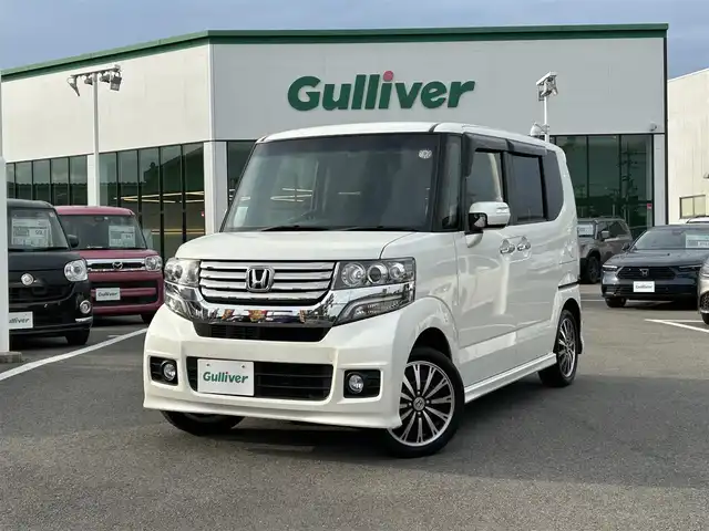 ホンダ Ｎ ＢＯＸ カスタム G ターボパッケージ 愛媛県 2012(平24)年 4.9万km プレミアムホワイトパール 純正ナビ（VXM-128VSX）/CD/DVD/ワンセグ/SD/バックカメラ/ETC/ドライブレコーダー（フロント）/クルーズコントロール/オートライト/LEDヘッドライト/ハロゲンフォグランプ/スマートキー/両側パワースライドドア/オートエアコン/MTモード付AT/純正マット/純正アルミホイール