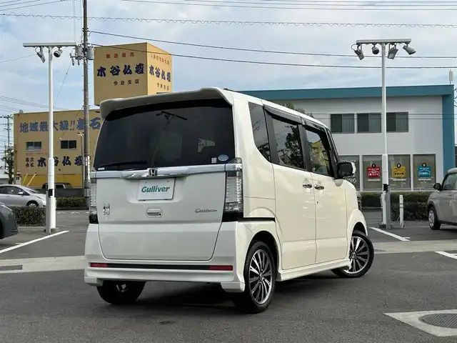 ホンダ Ｎ ＢＯＸ カスタム G ターボパッケージ 愛媛県 2012(平24)年 4.9万km プレミアムホワイトパール 純正ナビ（VXM-128VSX）/CD/DVD/ワンセグ/SD/バックカメラ/ETC/ドライブレコーダー（フロント）/クルーズコントロール/オートライト/LEDヘッドライト/ハロゲンフォグランプ/スマートキー/両側パワースライドドア/オートエアコン/MTモード付AT/純正マット/純正アルミホイール