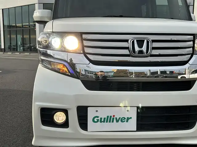 ホンダ Ｎ ＢＯＸ カスタム G ターボパッケージ 愛媛県 2012(平24)年 4.9万km プレミアムホワイトパール 純正ナビ（VXM-128VSX）/CD/DVD/ワンセグ/SD/バックカメラ/ETC/ドライブレコーダー（フロント）/クルーズコントロール/オートライト/LEDヘッドライト/ハロゲンフォグランプ/スマートキー/両側パワースライドドア/オートエアコン/MTモード付AT/純正マット/純正アルミホイール