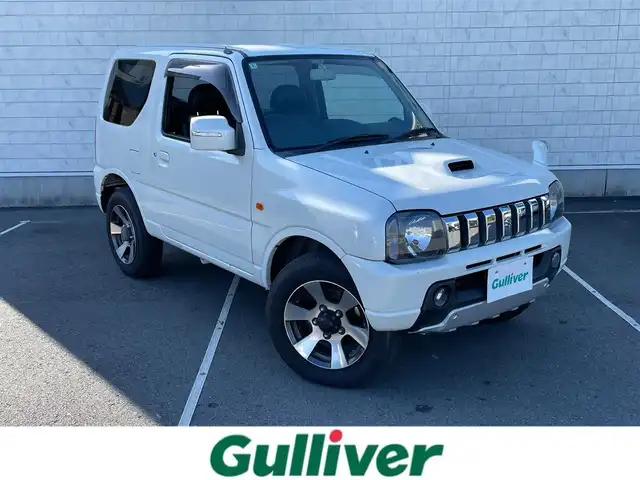 スズキ ジムニー クロスアドベンチャー XC 静岡県 2012(平24)年 5.3万km パールホワイト 社外ナビ/（AM/FM/CD/DVD）/ワンセグTV/リモコンキー/レザーシート/運転席シートヒーター/４WD/純正16インチアルミホイール/純正16インチアルミホイール付きスタッドレスタイヤ積込/純正フロアマット/背面タイヤ/取扱説明書/保証書