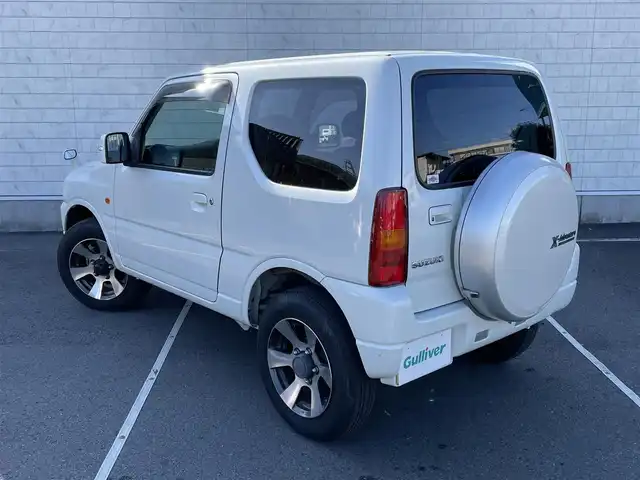 スズキ ジムニー クロスアドベンチャー XC 静岡県 2012(平24)年 5.3万km パールホワイト 社外ナビ/（AM/FM/CD/DVD）/ワンセグTV/リモコンキー/レザーシート/運転席シートヒーター/４WD/純正16インチアルミホイール/純正16インチアルミホイール付きスタッドレスタイヤ積込/純正フロアマット/背面タイヤ/取扱説明書/保証書