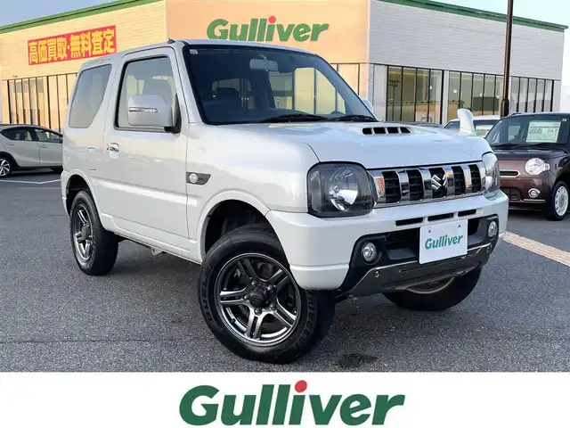 スズキ ジムニー ランドベンチャー 鳥取県 2017(平29)年 6.4万km パールホワイト ４ＷＤ・ターボ/社外ナビ／ＴＶ／ＤＶＤ／ＣＤ／ＢＴ/ＥＴＣ/ドライブレコーダー/レザーシート/前席シートヒーター/モンスタースポーツハイトアップスプリング/（純正車高　プラス20ｍｍ）/スズキスポーツショックアブソーバー/純正１６アルミホイール/キーレスキー/純正フォグランプ/電動格納ミラー/背面タイヤ/スペアキー