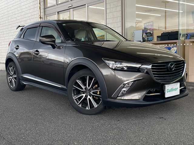 マツダ ＣＸ－３ XD ツーリング Lパッケージ 山口県 2015(平27)年 4.1万km チタニウムフラッシュマイカ ワンオーナー/純正SDナビ/AM/FM/CD/DVD/BT/USB/フルセグTV/バックカメラ/ハーフレザーシート/シートヒーター/純正アルミ/エアバッグダブル＋サイド/Boseサウンドシステム/i-ELOOP搭載/コーナーセンサー/パドルシフト/アイドリングストップ/レーンキープアシスト/TCS/クルーズコントロール/横滑り防止機能装置/プリクラッシュ/ステアリングスイッチ/スタッドレスタイヤ積み込み/４WD/保証書/取扱説明書