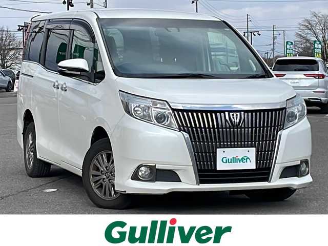 トヨタ エスクァイア Gi 道央・札幌 2016(平28)年 16.4万km ホワイトパールクリスタルシャイン ４WD/寒冷地仕様/純正ディーラーOPナビ/CD/DVD/BT/フルセグ/純正フリップダウンモニター/プリクラッシュセーフティ/横滑り防止装置/クルーズコントロール/レーンキープアシスト/パーキングアシスト/バックカメラ/ビルトインETC/アイドリングストップ/ワイパーデアイサー/ECOMODE/両側パワースライドドア/前席シートヒーター/レザーシート/革巻きウッドコンビステアリング/ステアリングリモコン/MTモード付AT/プッシュスタート/スマートキー/LEDヘッドライト/オートライト/オートハイビーム/フォグランプ/電動格納ミラー/ウィンカーミラー/純正フロアマット/ドアバイザー