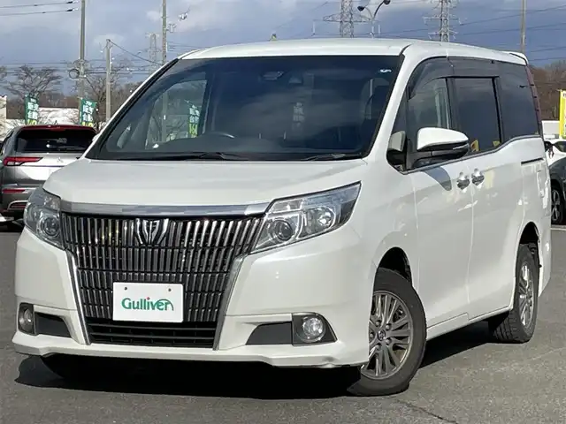 トヨタ エスクァイア Gi 道央・札幌 2016(平28)年 16.4万km ホワイトパールクリスタルシャイン ４WD/寒冷地仕様/純正ディーラーOPナビ/CD/DVD/BT/フルセグ/純正フリップダウンモニター/プリクラッシュセーフティ/横滑り防止装置/クルーズコントロール/レーンキープアシスト/パーキングアシスト/バックカメラ/ビルトインETC/アイドリングストップ/ワイパーデアイサー/ECOMODE/両側パワースライドドア/前席シートヒーター/レザーシート/革巻きウッドコンビステアリング/ステアリングリモコン/MTモード付AT/プッシュスタート/スマートキー/LEDヘッドライト/オートライト/オートハイビーム/フォグランプ/電動格納ミラー/ウィンカーミラー/純正フロアマット/ドアバイザー