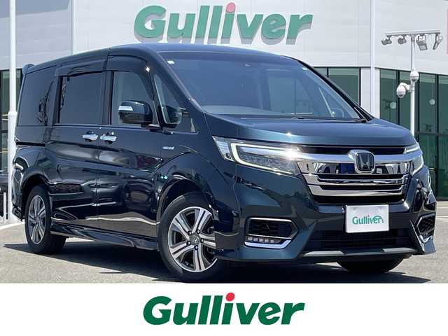 ホンダ ステップワゴン スパーダ ハイブリッド G ホンダセンシング 佐賀県 2018(平30)年 8.1万km フォレストグリーンパール ワンオーナー/アダプティブクルーズコントロール/衝突軽減ブレーキ/先行車発進お知らせ機能/路外逸脱抑制システム/レーンキープアシスト/標識認識機能/純正9インチメモリーナビ/フリップダウンモニター/バックカメラ/ビルトインETC/両側パワースライドドア/電子パーキング/ブレーキホールド機能/キャプテンシート/後席用サイドサンシェード/革巻きステアリング/ステアリングリモコン/純正16インチアルミホイール/純正LEDヘッドライト/ウィンカーミラー/ドアバイザ―/プッシュスタート/スペアキー/保証書/取扱説明書
