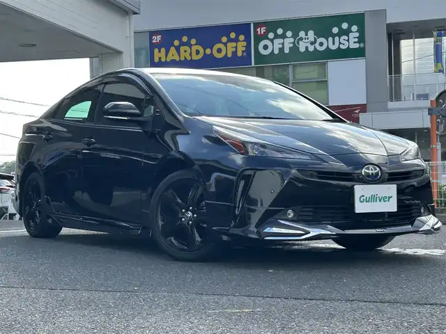 トヨタ プリウス A ツーリングセレ ブラックED 長崎県 2022(令4)年 0.7万km プレシャスブラックパール 純正ディスプレイオーディオ(FM/AM/BT/ナビ)/全方位カメラ/ステアリングリモコン/クルーズコントロール/プッシュスタート/スマートキー/スペアキー/ヘッドアップディスプレイ/運転席パワーシート/前席シートヒーター/100V充電/ビルトインETC/ドラレコ/純正フロアマット/電動格納ミラー/ドアバイザー/モデリスタフルエアロ/クリアランスソナー/ABS/横滑り防止装置/レーンキープアシスト/盗難防止装置/オートライト/オートハイビーム/SRSダブルエアバッグ/車両接近通報装置/取扱説明書/保証書/記録簿