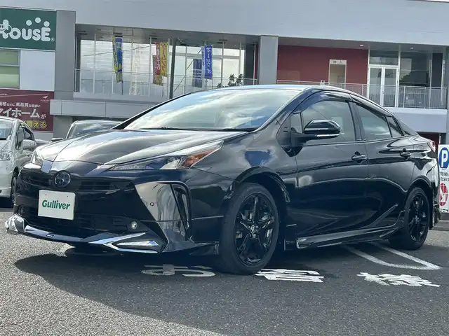 トヨタ プリウス A ツーリングセレ ブラックED 長崎県 2022(令4)年 0.7万km プレシャスブラックパール 純正ディスプレイオーディオ(FM/AM/BT/ナビ)/全方位カメラ/ステアリングリモコン/クルーズコントロール/プッシュスタート/スマートキー/スペアキー/ヘッドアップディスプレイ/運転席パワーシート/前席シートヒーター/100V充電/ビルトインETC/ドラレコ/純正フロアマット/電動格納ミラー/ドアバイザー/モデリスタフルエアロ/クリアランスソナー/ABS/横滑り防止装置/レーンキープアシスト/盗難防止装置/オートライト/オートハイビーム/SRSダブルエアバッグ/車両接近通報装置/取扱説明書/保証書/記録簿