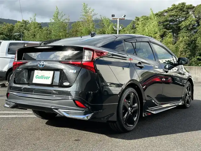 トヨタ プリウス A ツーリングセレ ブラックED 長崎県 2022(令4)年 0.7万km プレシャスブラックパール 純正ディスプレイオーディオ(FM/AM/BT/ナビ)/全方位カメラ/ステアリングリモコン/クルーズコントロール/プッシュスタート/スマートキー/スペアキー/ヘッドアップディスプレイ/運転席パワーシート/前席シートヒーター/100V充電/ビルトインETC/ドラレコ/純正フロアマット/電動格納ミラー/ドアバイザー/モデリスタフルエアロ/クリアランスソナー/ABS/横滑り防止装置/レーンキープアシスト/盗難防止装置/オートライト/オートハイビーム/SRSダブルエアバッグ/車両接近通報装置/取扱説明書/保証書/記録簿