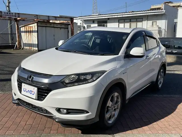 ホンダ ヴェゼル ハイブリッド X 福岡県 2014(平26)年 10.9万km ホワイトオーキッドパール (株)IDOMが運営する【じしゃロン八幡西店】の自社ローン対象車両になります。こちらは現金ご利用時の価格です。自社ローンご希望の方は別途その旨お申付け下さい。/衝突被害軽減システム/スマートキー/純正メモリナビ/Bluetooth/ワンセグ/バックカメラ/オートライト/LEDヘッドライト/パドルシフト/クルーズコントロール/ETC