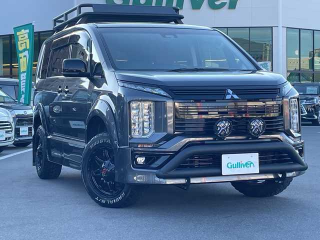 三菱 デリカＤ：５ アーバンギア G パワーパッケージ 長野県 2019(平31)年 3.2万km アイガーグレーメタリック 禁煙車/社外7インチナビ(AM/FM/DVD/TV/Bluetooth)/パートタイム4WD/両側電動スライドドア/電動リアゲート/全方位カメラ/バックカメラ/レーダークルーズコントロール/GIGEARオフロードギア/・アルミルーフラック/・フロントグリルカバー/・LEDフォグランプ/・オーバーフェンダーカバー/・リアラダー/1.5インチリフトアップ/ブラウンレザーシートカバー/社外17インチアルミ(235/65R17)/フルセグTV/ETC/革巻きステアリング/ステアリングスイッチ/運転席電動シート/前席シートヒーター/オートライト/オートハイビーム/衝突被害軽減装置/車線逸脱警報システム/レーンキープアシスト/ＭＴモード付ＡＴ/パドルシフト/プッシュスタート/スマートキー/スペアキー