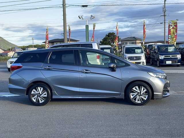 ホンダ シャトル ハイブリッド ホンダセンシング 香川県 2019(平31)年 4.3万km シャイニンググレーM 社外ナビ/フルセグテレビ/CD／DVD再生機能/バックカメラ/ドライブレコーダー/オートライト/レーダー探知機/アイドリングストップ/ETC/スペアキー