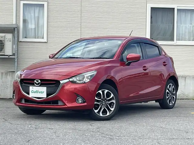 マツダ デミオ XD ツーリング 青森県 2015(平27)年 7.4万km ソウルレッドプレミアムメタリック AIS評価3.5点　外装C内装C/４WD/ターボ車/マツダ純正ナビ/AM/FM/DVD/ワンセグ/USB/AUX/Bluetooth/純正エンジンスターター/クルーズコントロール/衝突軽減システム/バックカメラ/ヘッドアップディスプレイ/ドライブレコーダー/TVキャンセラー/プッシュスタート/HIDヘッドライト/スペアキー/純正フロアマット/社外AW１５インチスタッドレスタイヤ車載/取扱説明書/保証書