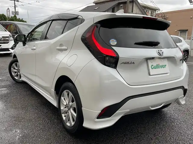 トヨタ アクア Z 大分県 2021(令3)年 2.8万km プラチナホワイトパールマイカ モデリスタエアロ/メーカーナビ 【BTオーディオ】/全方位カメラ/ハーフレザー調シート/純正15インチアルミホイール/レーンアシスト/プリクラッシュセーフティ/レーダークルーズコントロール/パーキングアシスト/クリアランスソナー/充電用USBソケット（Cタイプ）/AC100V電源/運転席パワーシート/前席シートヒーター/LEDヘッドライト/LEDフォグランプ/オートライト/オートマチックハイビーム/ヘッドライトレベライザー/レザーステアリング/ステアリングヒーター/ステアリングリモコン/チルトステアリング/ウインカーミラー/エンジンプッシュスタート/リアプライバシーガラス/横滑り防止装置/ドアバイザー/フロアマット/オートリトラミラー/サイド＆Wエアバッグ/ABS/スマートキー×2/保証書/車両取説/ナビ取説