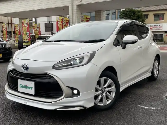 トヨタ アクア Z 大分県 2021(令3)年 2.8万km プラチナホワイトパールマイカ モデリスタエアロ/メーカーナビ 【BTオーディオ】/全方位カメラ/ハーフレザー調シート/純正15インチアルミホイール/レーンアシスト/プリクラッシュセーフティ/レーダークルーズコントロール/パーキングアシスト/クリアランスソナー/充電用USBソケット（Cタイプ）/AC100V電源/運転席パワーシート/前席シートヒーター/LEDヘッドライト/LEDフォグランプ/オートライト/オートマチックハイビーム/ヘッドライトレベライザー/レザーステアリング/ステアリングヒーター/ステアリングリモコン/チルトステアリング/ウインカーミラー/エンジンプッシュスタート/リアプライバシーガラス/横滑り防止装置/ドアバイザー/フロアマット/オートリトラミラー/サイド＆Wエアバッグ/ABS/スマートキー×2/保証書/車両取説/ナビ取説