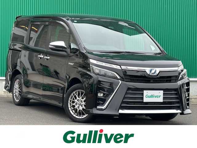 トヨタ ヴォクシー ハイブリッド ZS 煌 宮城県 2018(平30)年 6.8万km ブラック セーフティセンス/・プリクラッシュセーフティ/・レーンディパーチャーアラート/・オートマチックハイビーム/・先行車発進告知機能/純正9インチナビ（NSZT-Y66T）/・CD/DVD/・Bluetooth/・フルセグTV/バックカメラ/ビルトインETC/前席シートヒーター/両側パワースライドドア/革巻きステアリング/クルーズコントロール/ステアリングスイッチ/LEDヘッドランプ/フォグランプ/オートライト/スマートキー＆プッシュスタート/電動格納ミラー/純正16インチAW/純正フロアマット/純正ドアバイザー/Wエアバッグ