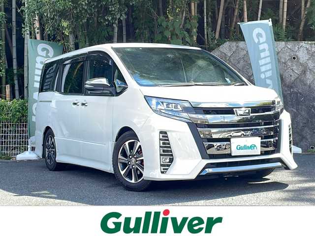 トヨタ ノア Si ダブルバイビーⅢ 京都府 2021(令3)年 2.8万km ホワイトパールクリスタルシャイン ワンオーナー/純正ナビ　NSZN-Z68T/FM/AM/CD/DVD/Bluetooth Audio/フルセグTV/バックカメラ/両側パワースライドドア/フリップダウンモニター/デジタルインナーミラー/TEIN車高調/ZERO1000エアクリーナー/クルーズコントロール/衝突軽減/車線逸脱/コーナーセンサー/ハーフレザーシート/前後ドラレコ/ビルトインETC/アイドリングストップ/純正フロアマット/純正ドアバイザー/純正AW