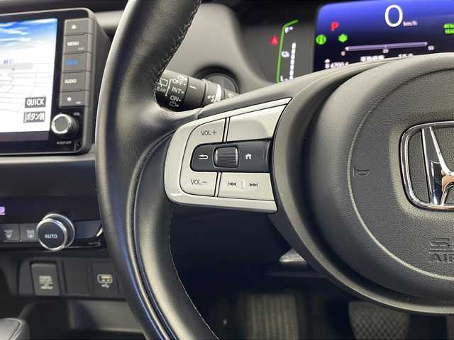 ホンダ フィット e:HEVホーム 栃木県 2021(令3)年 2.7万km プレミアムサンライトホワイトパール 禁煙車/純正ディーラーナビ（VXU-215FTi）/（AM/FM/BT/CD/DVD/フルセグTV）/アダプティブクルーズコントロール/バックカメラ/前後ドライブレコーダー/クリアランスソナー/LEDヘッドライト/オートライト/オートマチックハイビーム/先行車発進お知らせ/路外逸脱抑制制御/レーンキープアシストシステム/オートブレーキホールド/純正フロアマット/プッシュスタート/ドアバイザー/USB接続/ステアリングスイッチ/純正ドアバイザー/プッシュスタート/電動格納ミラー