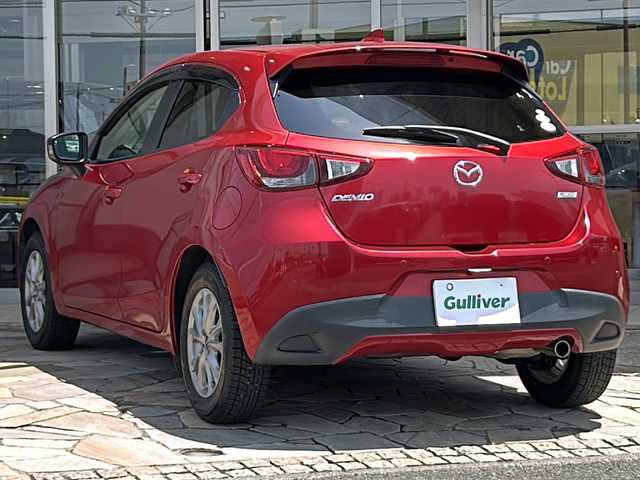 マツダ デミオ 13S Lパッケージ 静岡県 2015(平27)年 7.5万km ソウルレッドプレミアムメタリック 純正ナビ/・バックモニター/・Bluetooth/・フルセグTV/・USB/・AUX/・CD/DVD/・ステアリングスイッチ/主要装備/・プッシュスタート/・ETC車載器/・衝突被害軽減システム/・ハーフレザーシート/・LEDヘッドライト/・オートライト/・純正ＡＷ/・スマートキー/・スペアキー/・アイドリングストップ/・コーナーセンサー