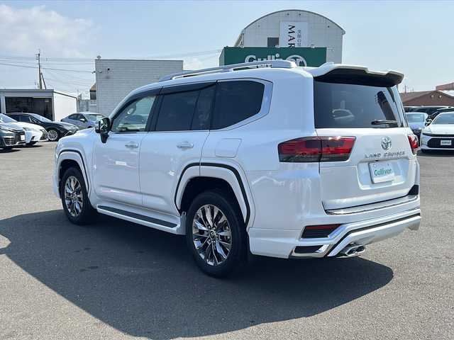 トヨタ ランドクルーザー ZX 鹿児島県 2025(令7)年 0.1千km プレシャスホワイトパール 純正ディスプレイオーディオ/フルセグTV/ETC2.0　/周囲カメラ/Bluetooth接続/クルーズコントロール/４WD/MTモード付AT/電動ムーンルーフ/電動リアゲート/パワーシート/レザーシート/ルーフレール/モデリスタ/オートライト/ヘッドレストモニター/ヘッドアップディスプレイ/電動格納サードシート/クールボックス/ワンオーナー/2025年改良モデル/純正20インチアルミホイール/純正フロアマット