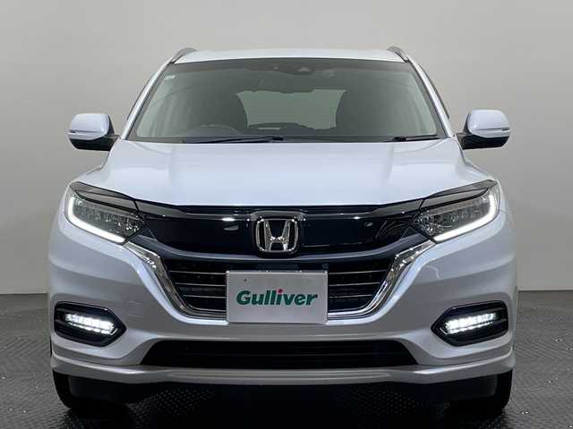 ホンダ ヴェゼル ハイブリッド Z ホンダセンシング 愛媛県 2019(令1)年 4.4万km プラチナホワイトパール ８型ナビ/フルセグ／Ｂｌｕｅｔｏｏｔｈ／ＣＤ／ＤＶＤ／ＵＳＢ/バックカメラ/ホンダセンシング/衝突軽減ブレーキ/レーダークルーズコントロール/ＥＴＣ/前方ドライブレコーダー/レーンキープアシスト/ＤＮ席シートヒーター/ハーフレザーシート/フロントフォグランプ/LEDヘッドライト