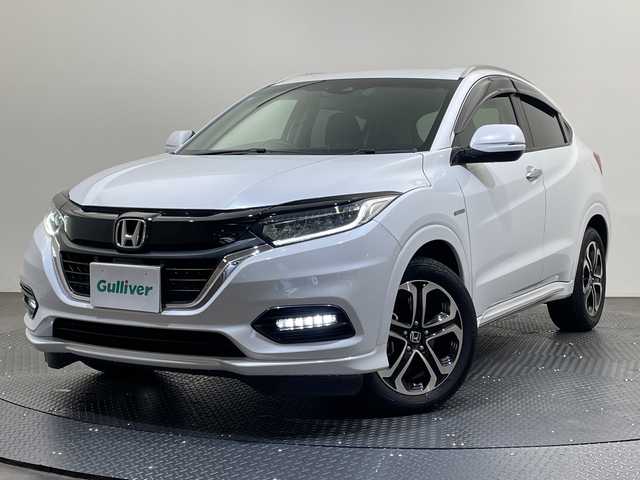 ホンダ ヴェゼル ハイブリッド Z ホンダセンシング 愛媛県 2019(令1)年 4.4万km プラチナホワイトパール ８型ナビ/フルセグ／Ｂｌｕｅｔｏｏｔｈ／ＣＤ／ＤＶＤ／ＵＳＢ/バックカメラ/ホンダセンシング/衝突軽減ブレーキ/レーダークルーズコントロール/ＥＴＣ/前方ドライブレコーダー/レーンキープアシスト/ＤＮ席シートヒーター/ハーフレザーシート/フロントフォグランプ/LEDヘッドライト