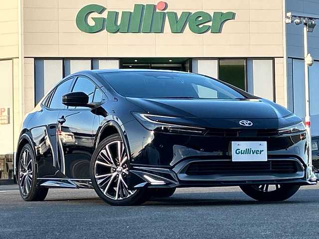 トヨタ プリウス Z 佐賀県 2023(令5)年 1.8万km アティチュードブラックマイカ モデリスタエアロ/純正12.3インチナビ(フルセグ/Bluetooth/Carplay)/全方位カメラ/D/N席シートヒーター・エアーシート/D席パワーシート・メモリーシート/ステアリングヒーター/前後ドライブレコーダー/ビルトイン2.0ETC/置くだけ充電/トヨタセーフティセンス/レーダークルーズコントロール/クリアランスソナー/LEDヘッドライト/オートライト/純正19インチアルミホイール/純正フロアマット