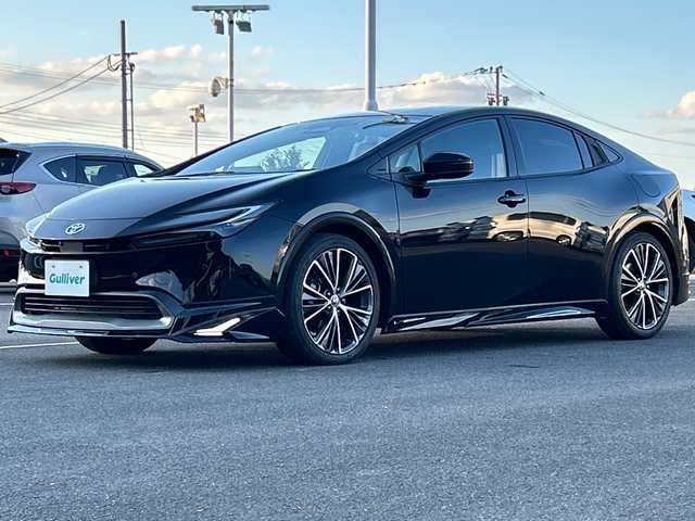 トヨタ プリウス Z 佐賀県 2023(令5)年 1.8万km アティチュードブラックマイカ モデリスタエアロ/純正12.3インチナビ(フルセグ/Bluetooth/Carplay)/全方位カメラ/D/N席シートヒーター・エアーシート/D席パワーシート・メモリーシート/ステアリングヒーター/前後ドライブレコーダー/ビルトイン2.0ETC/置くだけ充電/トヨタセーフティセンス/レーダークルーズコントロール/クリアランスソナー/LEDヘッドライト/オートライト/純正19インチアルミホイール/純正フロアマット