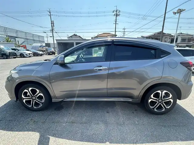 ホンダ ヴェゼル ハイブリッド Z ホンダセンシング 愛知県 2020(令2)年 2.5万km スーパープラチナグレーメタリック Gathers純正ナビ/（フルセグ、Bluetooth、CD/DVD、FM/AM）/レーダークルーズコントロール/ホンダセンシング/衝突軽減ブレーキ/バックカメラ/ETC/シートヒーター/コーナーセンサー/パドルシフト（MTモード）/LEDヘッドライト/ドライブレコーダー/全ドアワンタッチ式パワーウインドウ/プラズマクラスター技術搭載フルオートエアコン(左右独立)/スタッドレスタイヤ付き社外アルミ4本積込