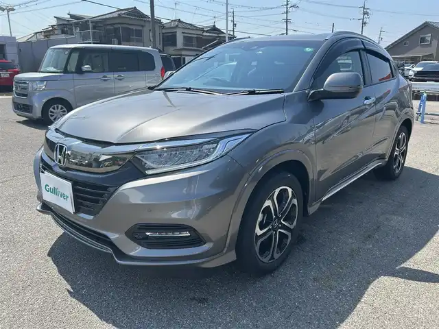 ホンダ ヴェゼル ハイブリッド Z ホンダセンシング 愛知県 2020(令2)年 2.5万km スーパープラチナグレーメタリック Gathers純正ナビ/（フルセグ、Bluetooth、CD/DVD、FM/AM）/レーダークルーズコントロール/ホンダセンシング/衝突軽減ブレーキ/バックカメラ/ETC/シートヒーター/コーナーセンサー/パドルシフト（MTモード）/LEDヘッドライト/ドライブレコーダー/全ドアワンタッチ式パワーウインドウ/プラズマクラスター技術搭載フルオートエアコン(左右独立)/スタッドレスタイヤ付き社外アルミ4本積込