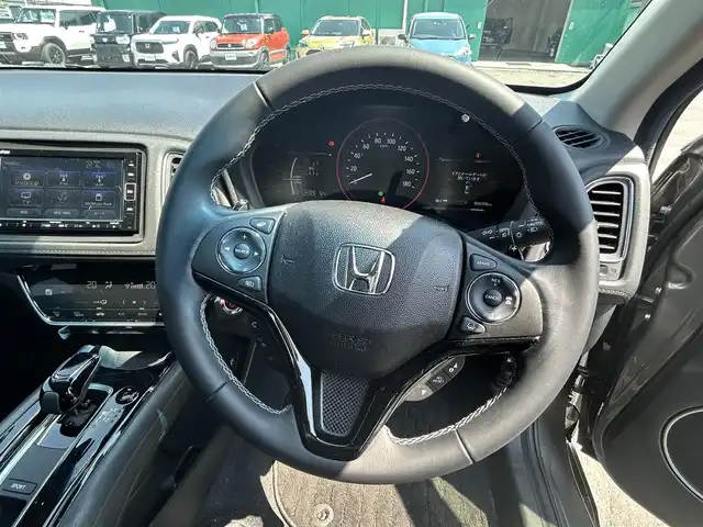 ホンダ ヴェゼル ハイブリッド Z ホンダセンシング 愛知県 2020(令2)年 2.5万km スーパープラチナグレーメタリック Gathers純正ナビ/（フルセグ、Bluetooth、CD/DVD、FM/AM）/レーダークルーズコントロール/ホンダセンシング/衝突軽減ブレーキ/バックカメラ/ETC/シートヒーター/コーナーセンサー/パドルシフト（MTモード）/LEDヘッドライト/ドライブレコーダー/全ドアワンタッチ式パワーウインドウ/プラズマクラスター技術搭載フルオートエアコン(左右独立)/スタッドレスタイヤ付き社外アルミ4本積込