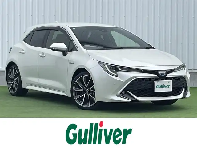 トヨタ カローラ スポーツ ハイブリッドG Z 香川県 2019(平31)年 4.6万km ホワイトパールクリスタルシャイン 登録時走行距離：46044km/純正9インチ「ナビ/フルセグTV/バックカメラ/ドライブレコーダー/ブラインドスポットモニター/レーダークルーズコントロール/レーダー探知機/LEDオートライト/フォグライト/コーナーセンサー/レーンキープアシスト/オートハイビーム/横滑り防止/スマートキー