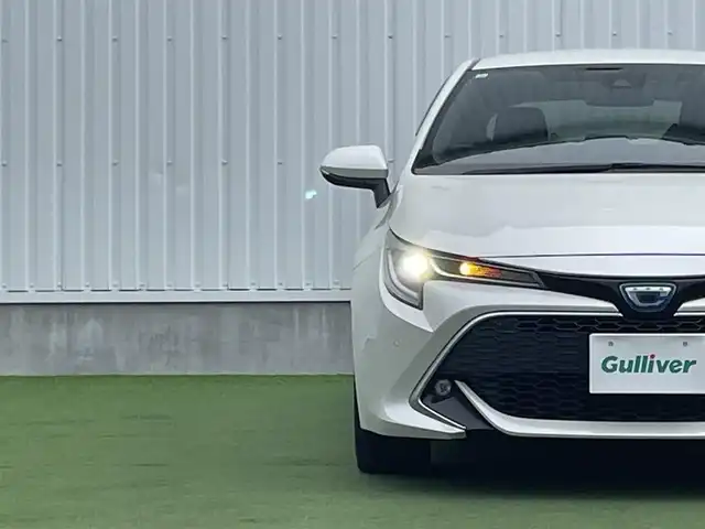 トヨタ カローラ スポーツ ハイブリッドG Z 香川県 2019(平31)年 4.6万km ホワイトパールクリスタルシャイン 登録時走行距離：46044km/純正9インチ「ナビ/フルセグTV/バックカメラ/ドライブレコーダー/ブラインドスポットモニター/レーダークルーズコントロール/レーダー探知機/LEDオートライト/フォグライト/コーナーセンサー/レーンキープアシスト/オートハイビーム/横滑り防止/スマートキー