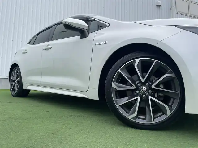 トヨタ カローラ スポーツ ハイブリッドG Z 香川県 2019(平31)年 4.6万km ホワイトパールクリスタルシャイン 登録時走行距離：46044km/純正9インチ「ナビ/フルセグTV/バックカメラ/ドライブレコーダー/ブラインドスポットモニター/レーダークルーズコントロール/レーダー探知機/LEDオートライト/フォグライト/コーナーセンサー/レーンキープアシスト/オートハイビーム/横滑り防止/スマートキー