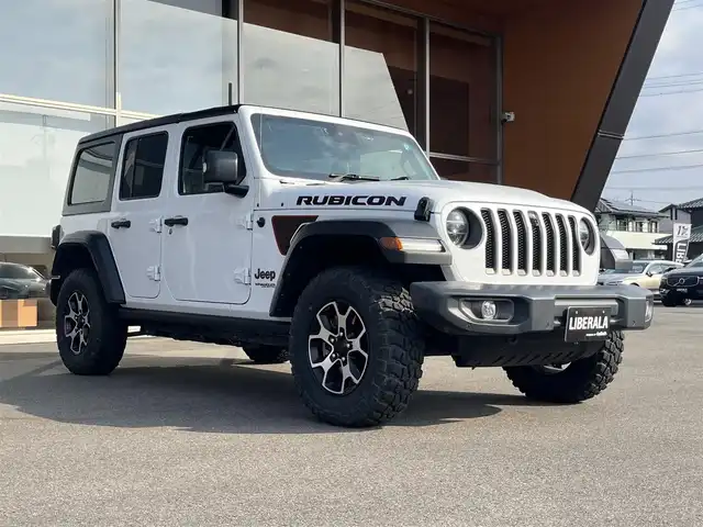 クライスラー・ジープ ジープ ラングラー アンリミテッド ルビコン 岐阜県 2021(令3)年 1.9万km ブライトホワイト オーディオナビゲーションシステム（Uconnect）/地デジテレビチューナー/Bluetooth/AppleCarPlay/Android Auto/バックカメラ/サブウーハー付きアルパインプレミアムスピーカー/Bestopサンライダーオープントップ/（純正ハードトップ有）/アダプティブクルーズコントロール/ブラインドスポットモニター/フロント、リアパークアシスト/前面衝突警報/RUBICONレザーシート/フロントシートヒーター/ヒーテッドステアリング/LEDヘッドライト/オートハイビーム