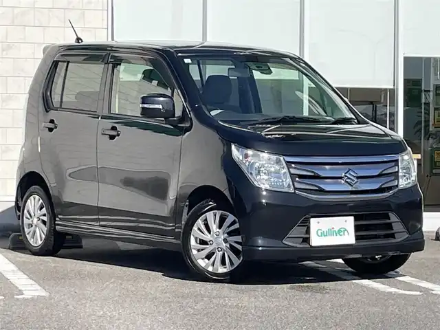 スズキ ワゴンＲ FZ 宮崎県 2015(平27)年 11.3万km ブルーイッシュブラックパール3 アイドリングストップ/プッシュスタート/純正フロアマット/純正LEDヘッドライト/オートライト/エアバックW/パワーステアリング/パワーウィンドウ/スマートキー/盗難防止装置/衝突被害軽減システム/横滑り防止装置/AAC/ABS/シートヒーター/純正アルミホイール（14インチ）