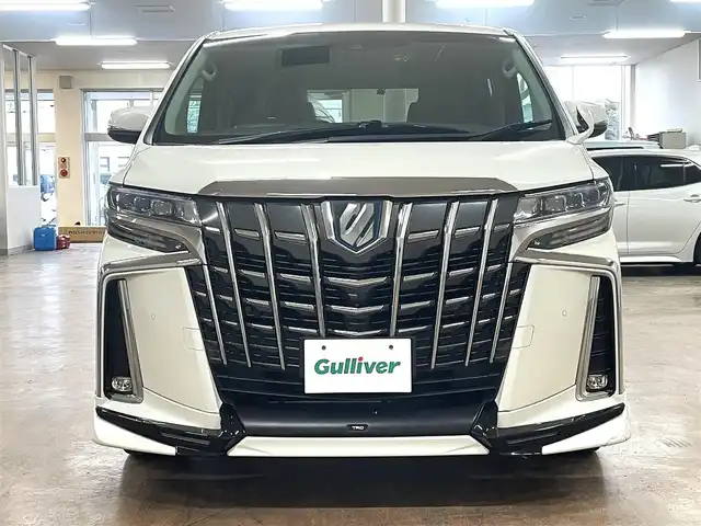 トヨタ アルファードハイブリット SR 道央・札幌 2019(平31)年 8.9万km ラグジュアリーホワイトパールクリスタルシャインガラスフレーク ワンオーナー/4WD/寒冷地仕様/OP　TRDエアロ（フロント/サイド/リア）/OP　TRD4本出しマフラー/ALPINE　11型ナビ/フルセグ/Bluetooth/CD/DVD/SD/HDMI/ALPINE　12.8型フリップダウンモニター/衝突軽減ブレーキ/レーンキープアシスト/横滑り防止/両側パワースライドドア/パワーバックドア/レーダークルーズコントロール/三眼LEDヘッドライト/シーケンシャルウィンカー/黒革シート/パワーシート（D/N）/エアーシート（D/N）/シートヒーター（D/N）/スマートキー×2/純正エンジンスターター/フロントワイパーデアイサー/コムテック前後ドラレコ/オートマチックハイビーム/保証書/取扱説明書
