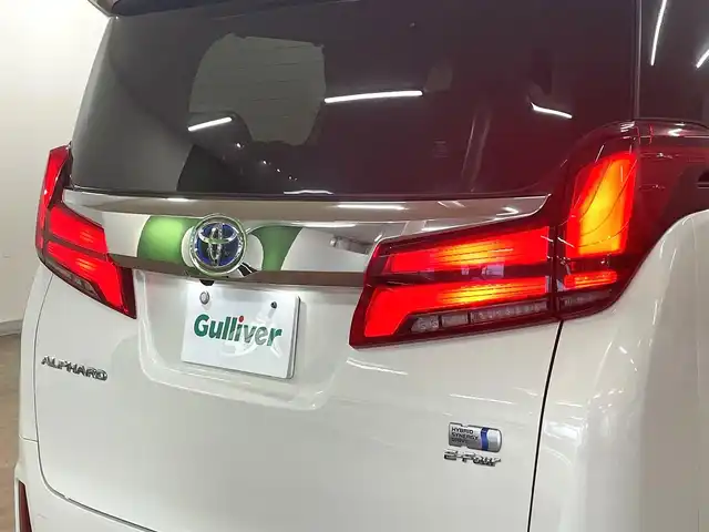 トヨタ アルファードハイブリット SR 道央・札幌 2019(平31)年 8.9万km ラグジュアリーホワイトパールクリスタルシャインガラスフレーク ワンオーナー/4WD/寒冷地仕様/OP　TRDエアロ（フロント/サイド/リア）/OP　TRD4本出しマフラー/ALPINE　11型ナビ/フルセグ/Bluetooth/CD/DVD/SD/HDMI/ALPINE　12.8型フリップダウンモニター/衝突軽減ブレーキ/レーンキープアシスト/横滑り防止/両側パワースライドドア/パワーバックドア/レーダークルーズコントロール/三眼LEDヘッドライト/シーケンシャルウィンカー/黒革シート/パワーシート（D/N）/エアーシート（D/N）/シートヒーター（D/N）/スマートキー×2/純正エンジンスターター/フロントワイパーデアイサー/コムテック前後ドラレコ/オートマチックハイビーム/保証書/取扱説明書