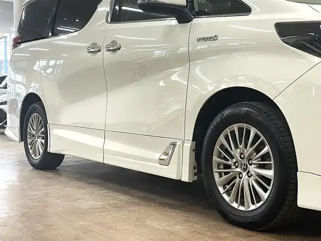 トヨタ アルファードハイブリット SR 道央・札幌 2019(平31)年 8.9万km ラグジュアリーホワイトパールクリスタルシャインガラスフレーク ワンオーナー/4WD/寒冷地仕様/OP　TRDエアロ（フロント/サイド/リア）/OP　TRD4本出しマフラー/ALPINE　11型ナビ/フルセグ/Bluetooth/CD/DVD/SD/HDMI/ALPINE　12.8型フリップダウンモニター/衝突軽減ブレーキ/レーンキープアシスト/横滑り防止/両側パワースライドドア/パワーバックドア/レーダークルーズコントロール/三眼LEDヘッドライト/シーケンシャルウィンカー/黒革シート/パワーシート（D/N）/エアーシート（D/N）/シートヒーター（D/N）/スマートキー×2/純正エンジンスターター/フロントワイパーデアイサー/コムテック前後ドラレコ/オートマチックハイビーム/保証書/取扱説明書