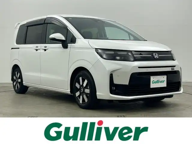 ホンダ フリード ハイブリット e:HEV AIR EX 岡山県 2025(令7)年 0.7万km プラチナホワイトパール 純正11.4インチナビ（LXM-247VFLi）/・FM/AM/Bluetooth/フルセグ/CD/DVD/全方位カメラ/ハーフレザーシート/・シートヒーター/両側パワースライドドア/ETC2.0/ドライブレコーダー/ホンダセンシング/・衝突軽減ブレーキ/・車線逸脱警報/・アダプティブクルーズコントロール/・オートハイビーム/BSM/オートブレーキホールド/純正フロアマット/純正アルミ/新車保証書/取扱説明書/スペアキー×１