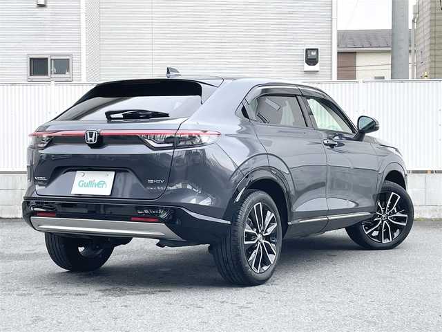 ホンダ ヴェゼル ハイブリッド e:HEV Z 栃木県 2023(令5)年 3.8万km メテオロイドグレーメタリック Honda SENSING/・衝突軽減ブレーキ(CMBS)/・誤発進抑制機能/・後方誤発進抑制機能/・近距離衝突軽減ブレーキ/・歩行者事故低減ステアリング/・路外逸脱抑制機能/・渋滞追従機能付アダプティブクルーズコントロー(ACC)/・車線維持支援システム(LKAS)/・トラフィックジャムアシスト(渋滞運転支援機能)/・先行車発進お知らせ機能/・標識認識機能/・オートハイビーム/・パーキングセンサーシステム/アダプティブドライビングビーム/ハンズフリーアクセスパワーテールゲート/純正9インチSDナビ［VXU-235VZi］/・フルセグ/・Bluetooth/・DVD/CD/SD/・USB/リアワイドカメラ/ETC/コンビシート/運転席＆助手席シートヒーター/パドルシフト/フルLEDヘッドライト/18インチアルミホイール